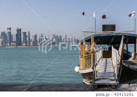 Ladder from Corniche Broadway on Traditional Wooden Boat invite to Gulf City tourist Tour. Beautiful 43415201