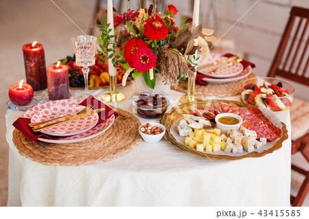 Luxury table settings for fine dining with candles and glassware, beautiful blurred background. For 43415585