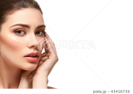 girl applying moisturizing cream isolated on white 43416739