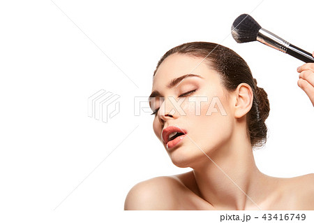 beautiful girl applying powder on face isolated on white beautiful girl applying powder on face isolated on white 43416749