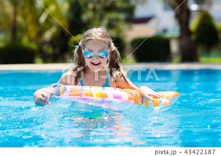 Child in swimming pool. Kids swim. Water play. 43422187