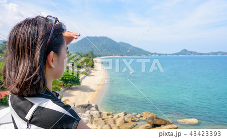 Woman tourist are looking at the sea 43423393