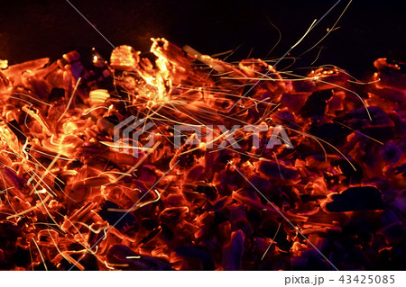 Burning firewood in the fireplace close up, BBQ fire, charcoal background. 43425085