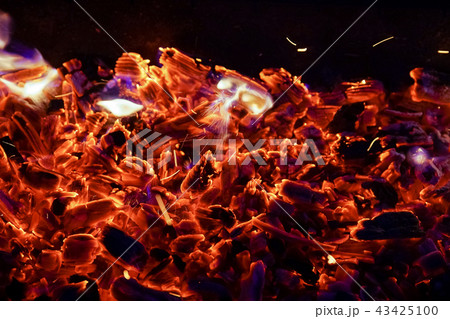 Burning firewood in the fireplace close up, BBQ fire, charcoal background. 43425100