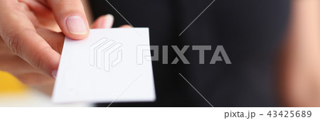 businesswoman give her business card to her new partner closeup businesswoman give her business card to her new partner closeup 43425689
