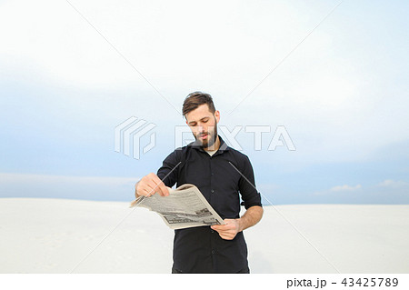 doctor reading newspaper in countryside. doctor reading newspaper in countryside. 43425789