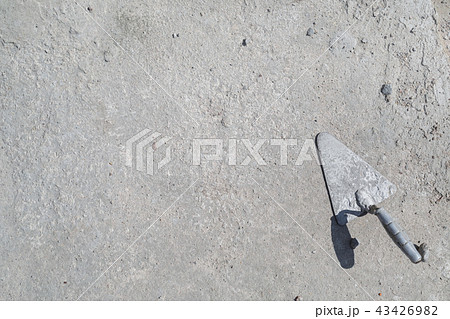 Trowel on concrete background 43426982