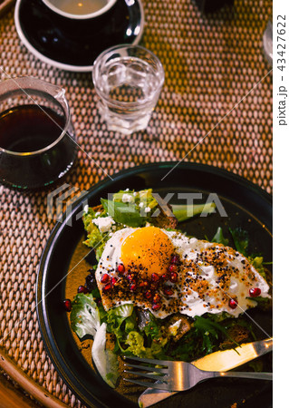 Avocado toast with egg on black plate 43427622
