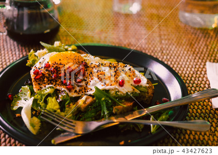 Avocado toast with egg on black plate 43427623