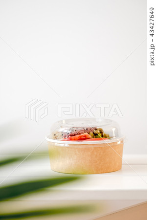 Take away salad in disposable paper bowl 43427649
