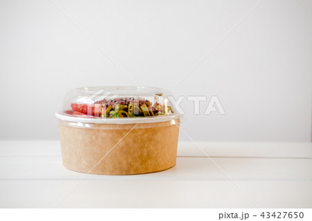 Take away salad in disposable paper bowl 43427650