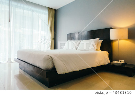 White comfortable pillow on bed White comfortable pillow on bed 43431310