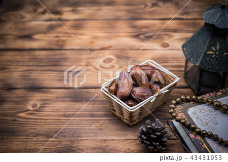 Arabic lantern with candle and date palm fruit 43431953