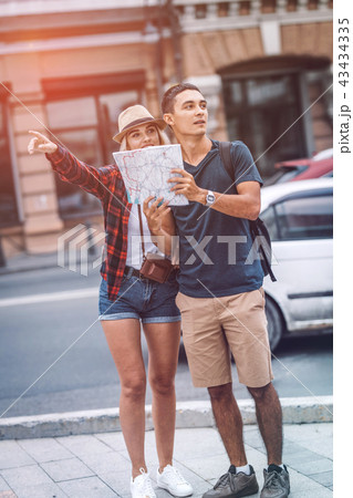 Couple with map orientating on street 43434335