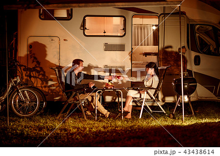Adult couple clinking glasses of wine.  43438614