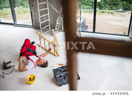 An accident of a man worker at the construction site. 43439366