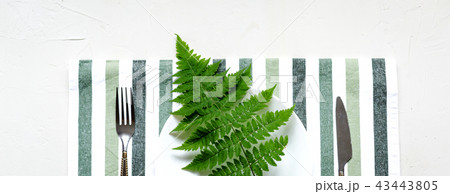 Tablesetting in white and green colors.Holiday Tablesetting in white and green colors.Holiday 43443805