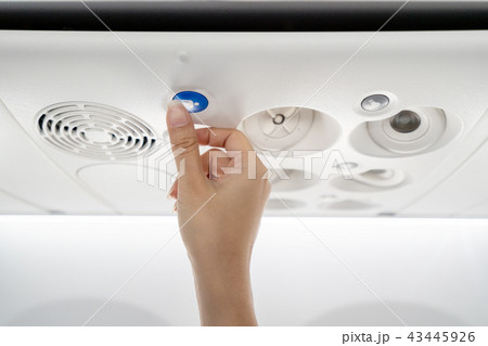 Close up of flight attendant's hand call cabin Close up of flight attendant's hand call cabin 43445926