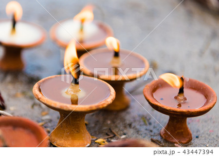 Terra-cota oil lamps as religious offerings Terra-cota oil lamps as religious offerings 43447394