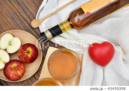 Apple cider vinegar on wooden board, Kombucha. 43450306