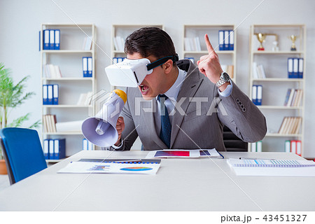 Businessman with virtual reality glasses in the office Businessman with virtual reality glasses in the office 43451327