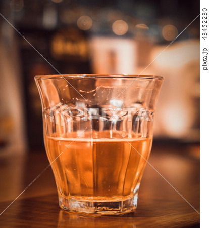 Alcoholic beverage on a wooden table in a pub. Alcoholic beverage on a wooden table in a pub. 43452230