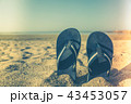 sandal flip flop on yellow sand Summer fun time 43453057