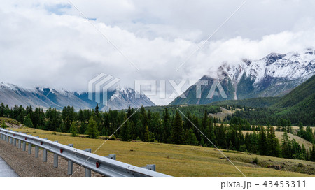 Road to the mountains, mountains with snowy peaks Road to the mountains, mountains with snowy peaks 43453311