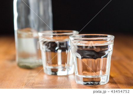 Vodka in shot glass. 43454752