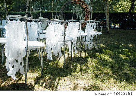 Beautiful setting for outdoors wedding ceremony on grass Beautiful setting for outdoors wedding ceremony on grass 43455261