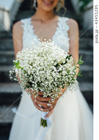 beautiful bouquet in hands of the bride beautiful bouquet in hands of the bride 43455295