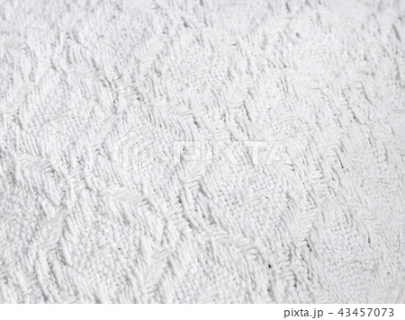 Texture of hand-woven white fabric. Rough threads 43457073
