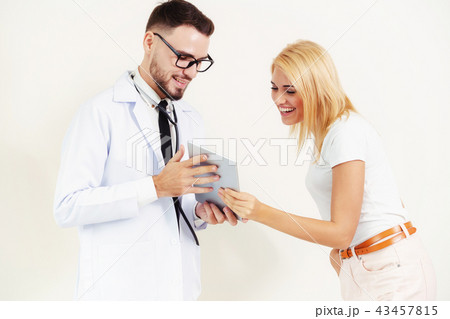 Male Doctor and Female Patient in Hospital. Male Doctor and Female Patient in Hospital. 43457815