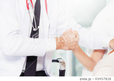 Male Doctor and Female Patient in Hospital Office Male Doctor and Female Patient in Hospital Office 43457816