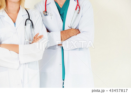 Portrait of confident doctors with arms crossed. 43457817