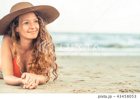 Happy young woman at beach in summer vacation. 43458053