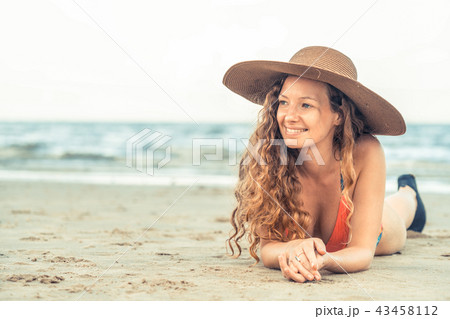 Happy young woman at beach in summer vacation. 43458112