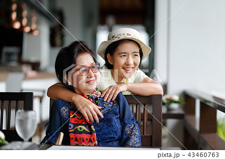 Senior woman with daughter relaxing on vacation Senior woman with daughter relaxing on vacation 43460763