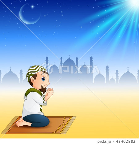 Muslim men sitting on the prayer rug while praying 43462882