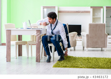 Man dressing up and late for work 43463172