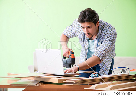 Woodworker working in his workshop Woodworker working in his workshop 43465688