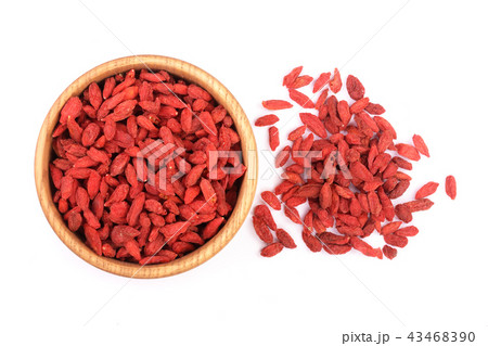Dried goji berries in wooden bowl Isolated on white background 43468390
