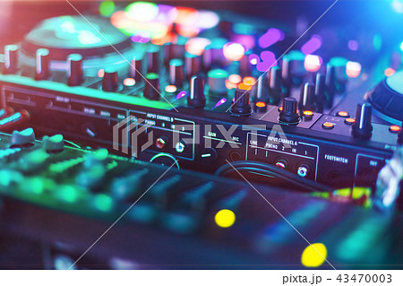 Audio Mixer console in a night club Audio Mixer console in a night club 43470003