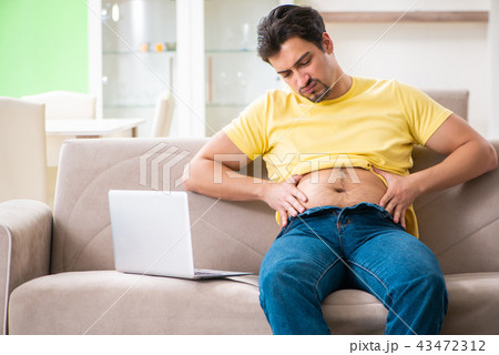 Young fat man in dieting concept Young fat man in dieting concept 43472312