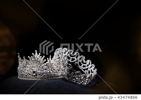Diamond Silver Crown for Miss Pageant Beauty queen Contest, Crystal Tiara jewelry decorated gems stone and black velvet fabric cloth, photography copy space for text logo Diamond Silver Crown for Miss Pageant Beauty queen Contest, Crystal Tiara jewelry decorated gems stone and black velvet fabric cloth, photography copy space for text logo 43474866