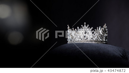 Diamond Silver Crown for Miss Pageant Beauty queen Contest, Crystal Tiara jewelry decorated gems stone and black velvet fabric cloth, photography copy space for text logo 43474872