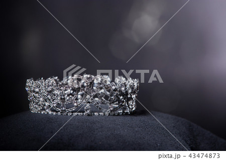 Diamond Silver Crown for Miss Pageant Beauty queen Contest, Crystal Tiara jewelry decorated gems stone and black velvet fabric cloth, photography copy space for text logo 43474873