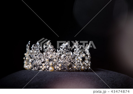 Diamond Silver Crown for Miss Pageant Beauty queen Contest, Crystal Tiara jewelry decorated gems stone and black velvet fabric cloth, photography copy space for text logo 43474874