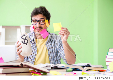 Student preparing for university exams with many conflicting pri 43475284