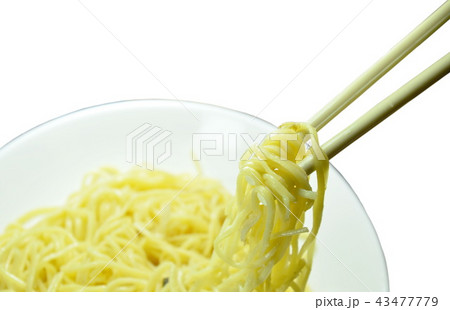 vegetarian yellow noodles picking in chopsticks  43477779